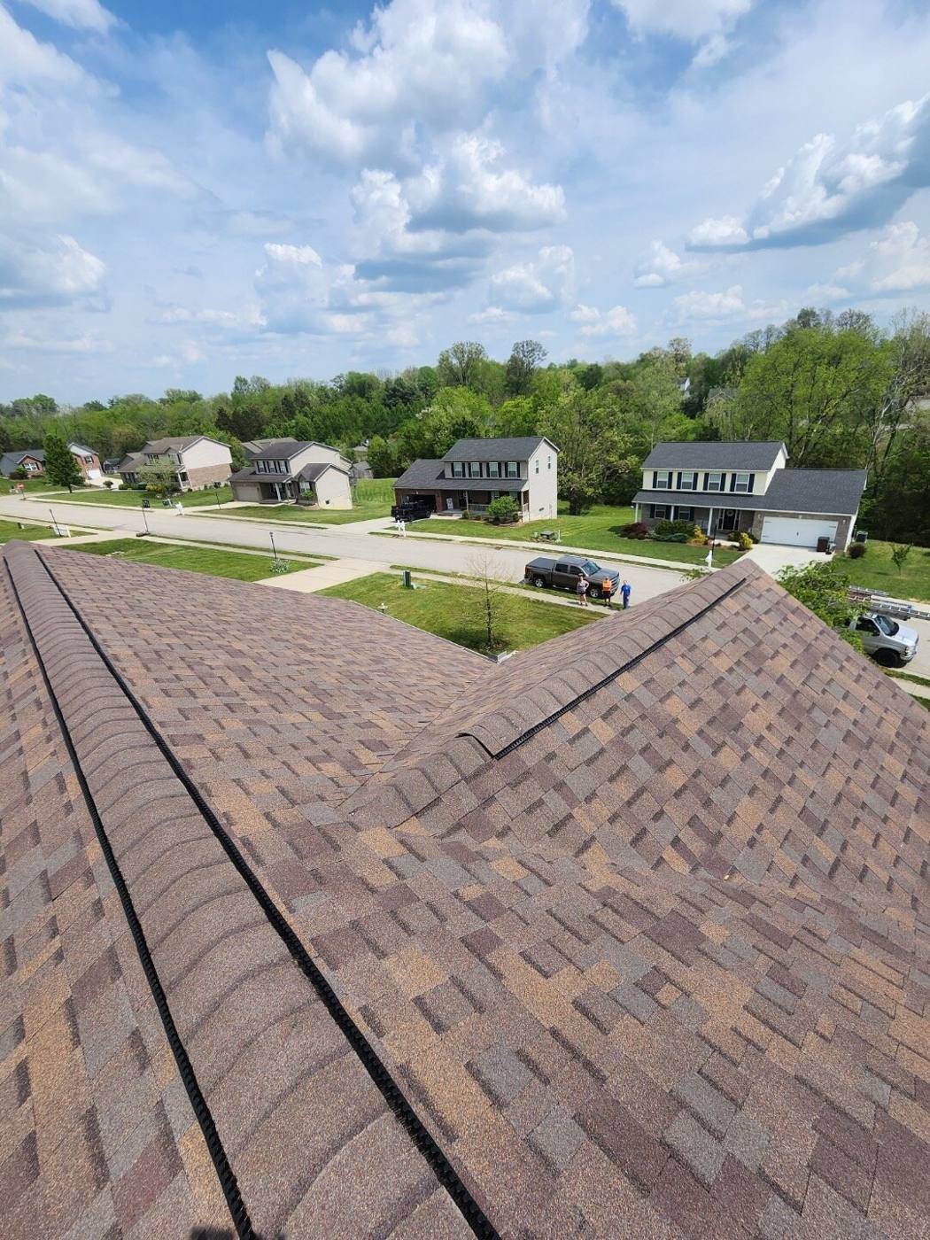 Aerial view of newly installed brown architectural shingle roof over a Cincinnati neighborhood