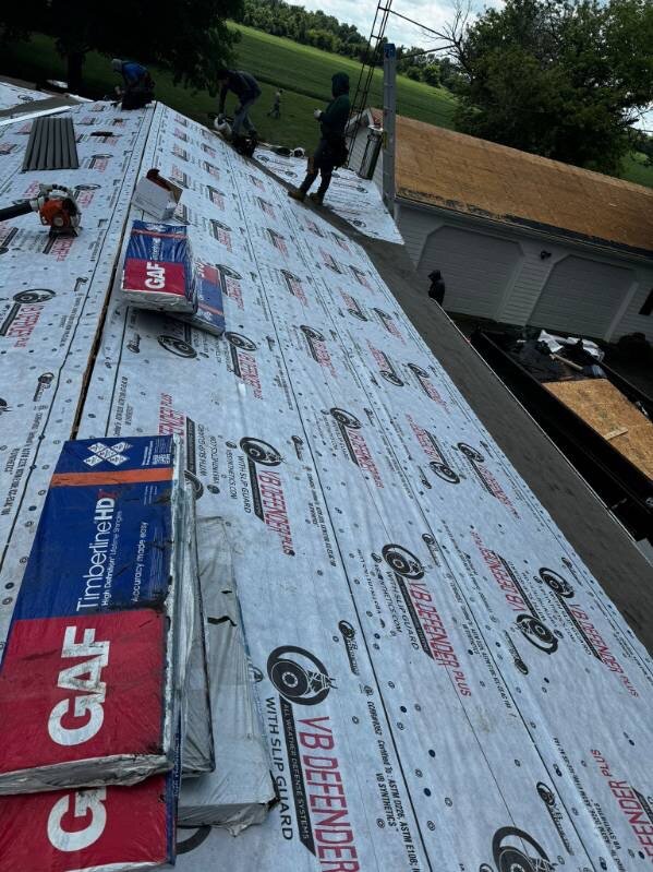 GAF Timberline shingles and VB Defender underlayment staged on a Gutter Buddy roofing project